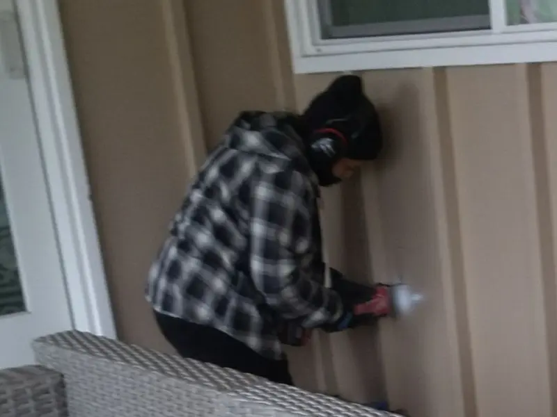 Professional electrician installing an exterior outlet in Social Circle
