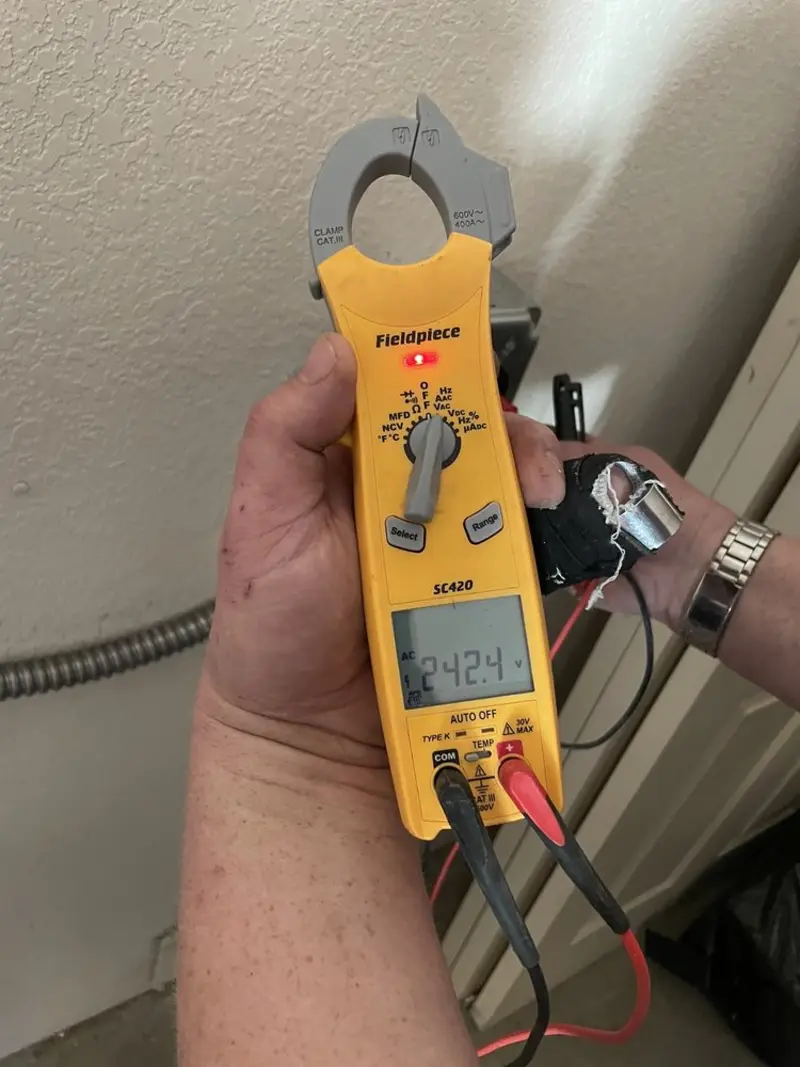 Voltage testing with clamp meter during Whole House Surge Protector in Social Circle